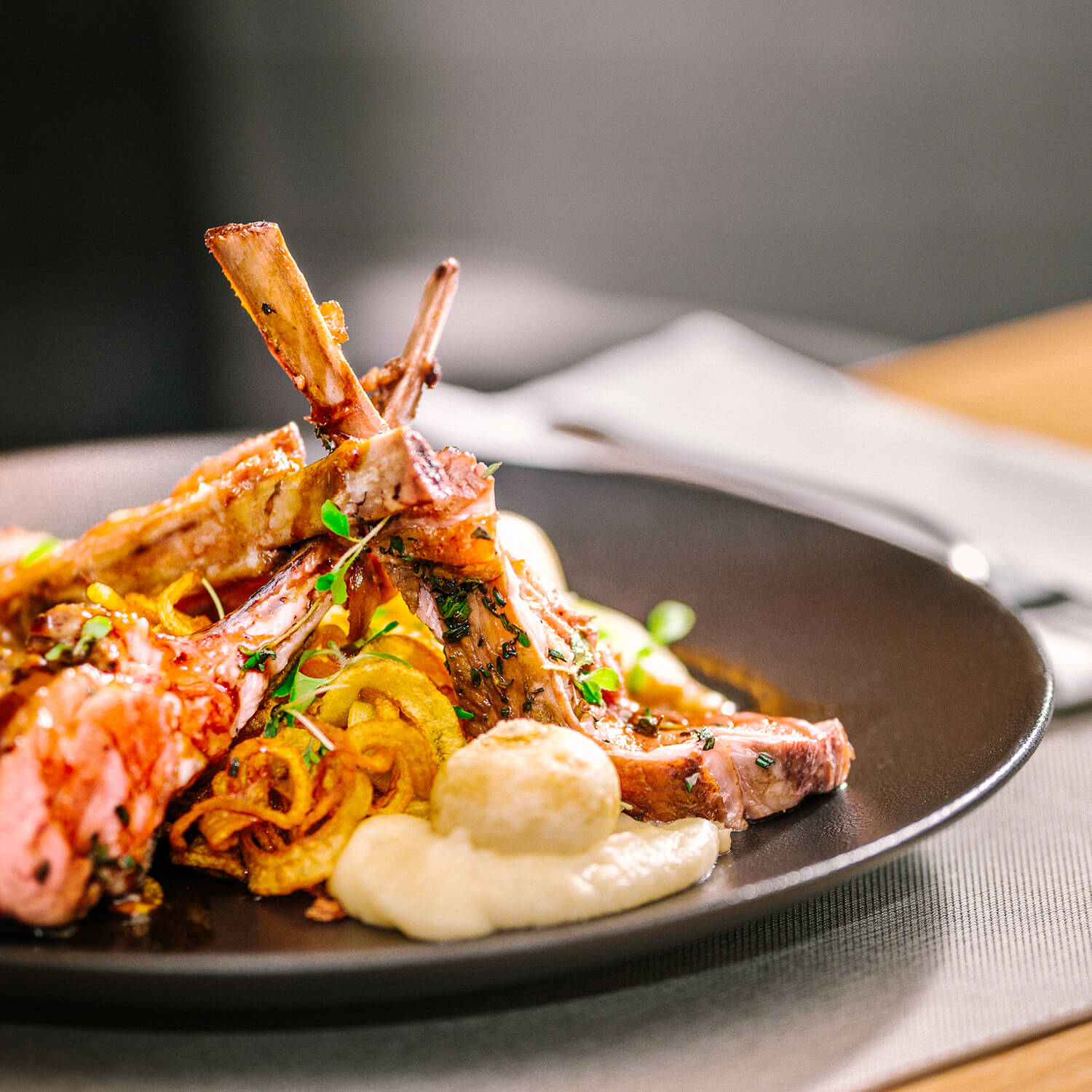 Herbed lamb loin, topped with lamb demi-glace "MANJULA " with potato spaghetti and kvaka