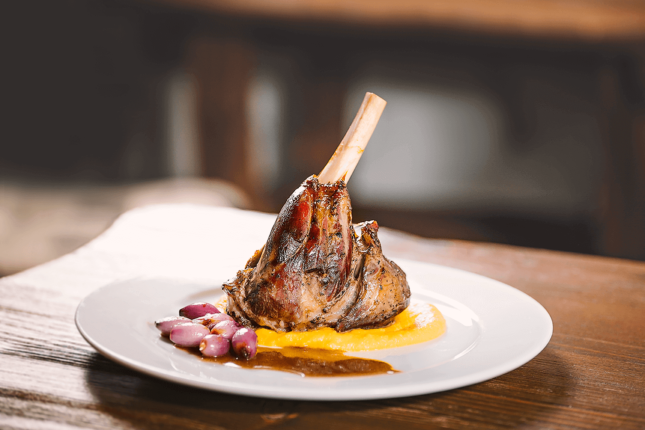 Lamb knuckle (sous-vide) with carrot-celery puree and glazed onions 